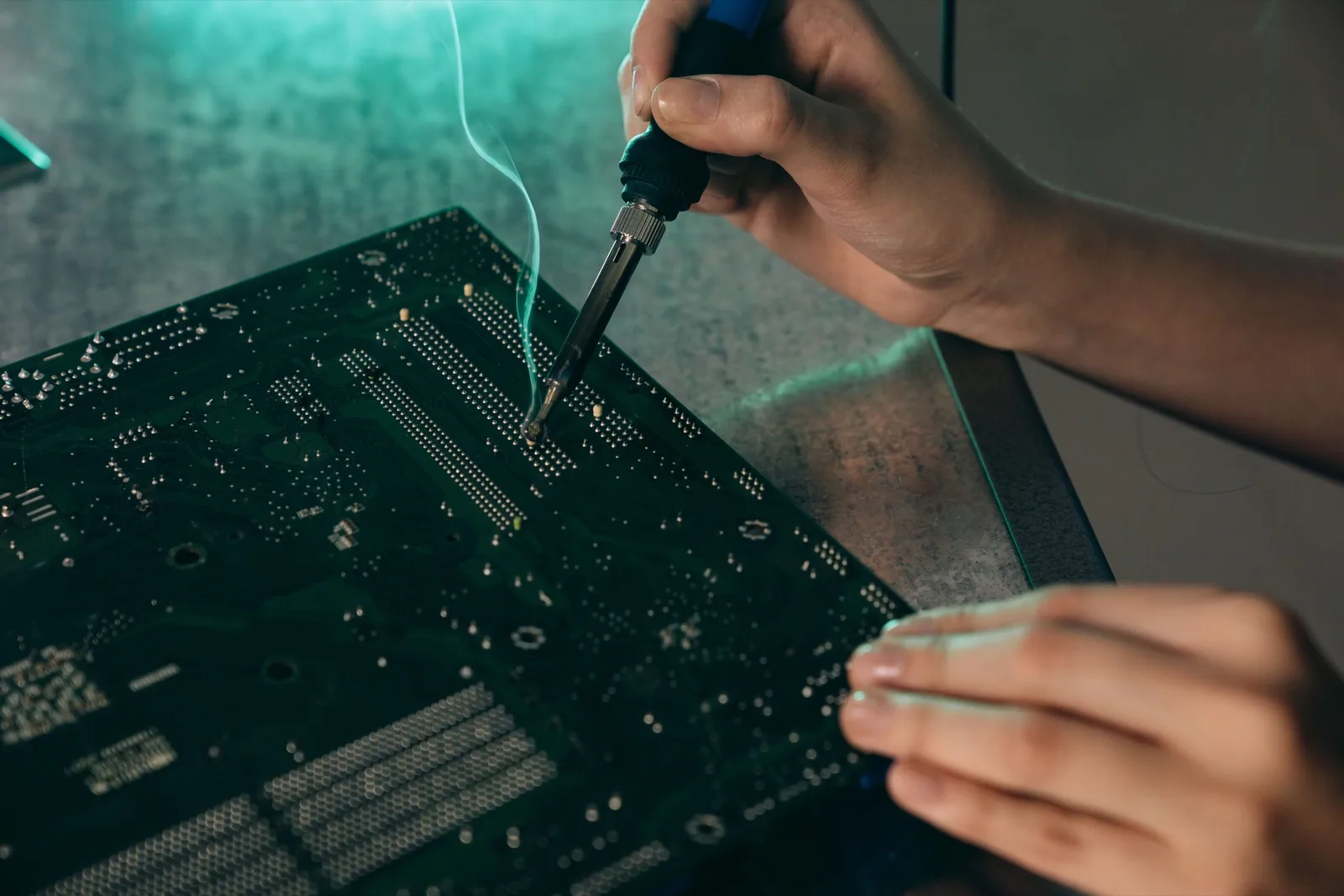 Hands soldering components on a circuit board